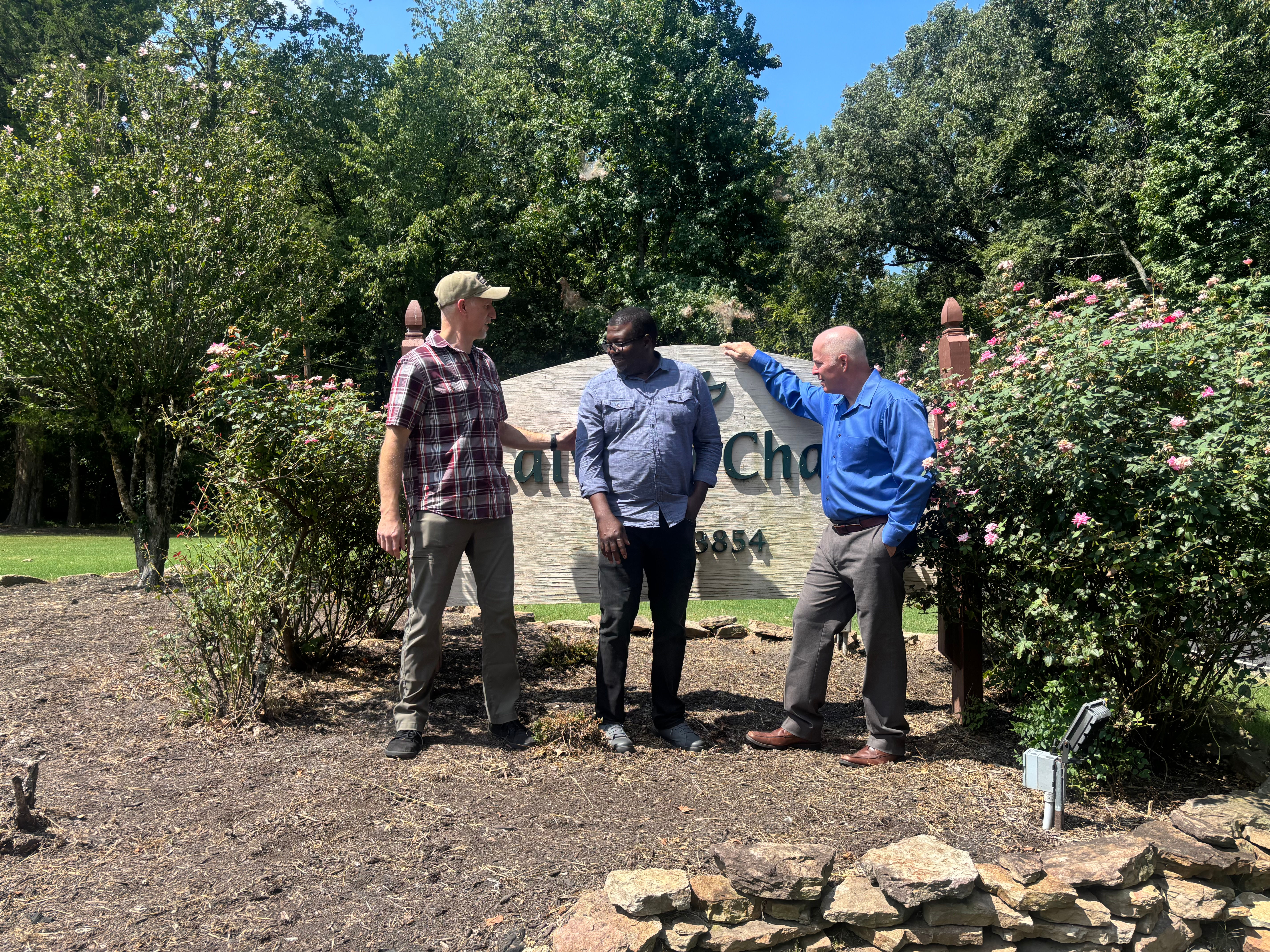 Ostep Wesley with members of his church family